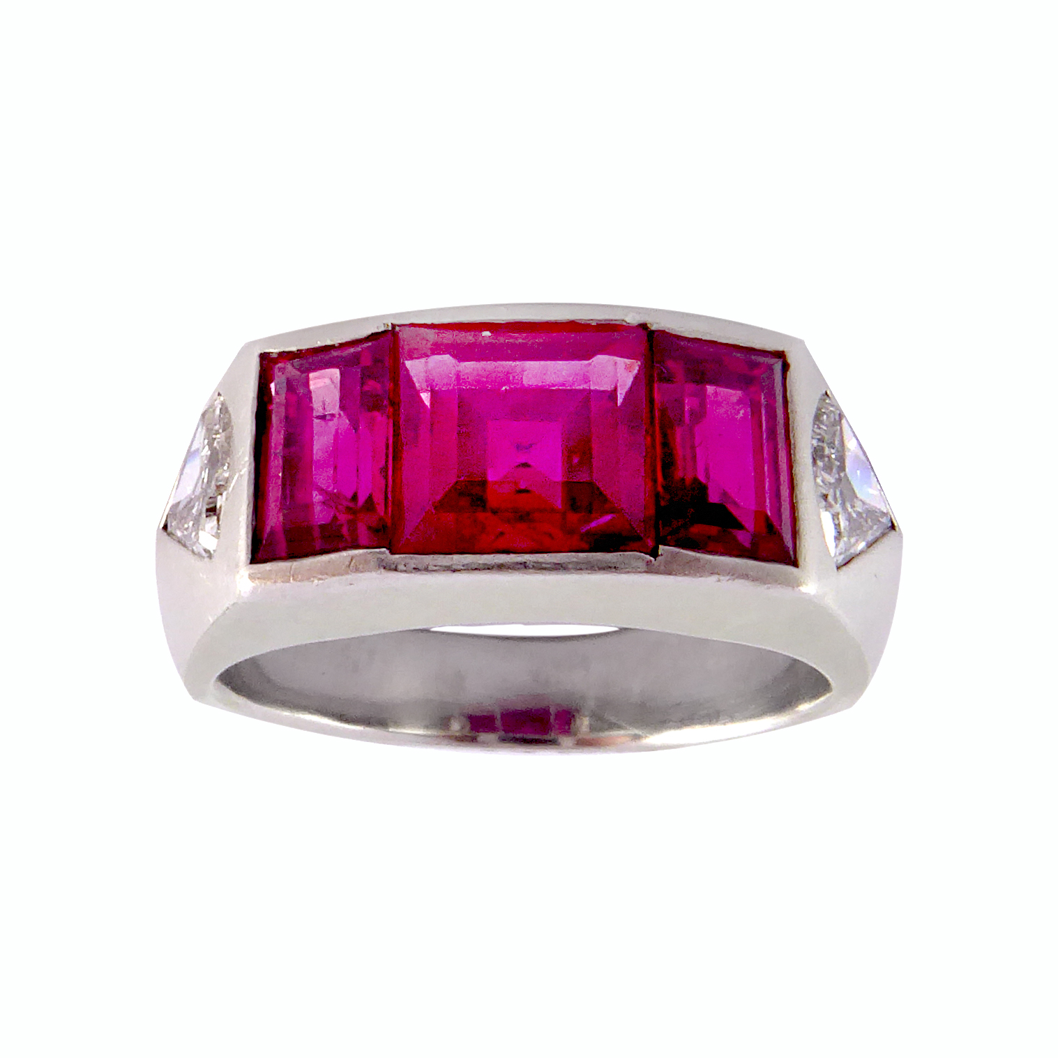 Art Deco three stone Burma ruby and diamond ring, the three graduated rectangular step cut rubies of approximately 2.55ct total